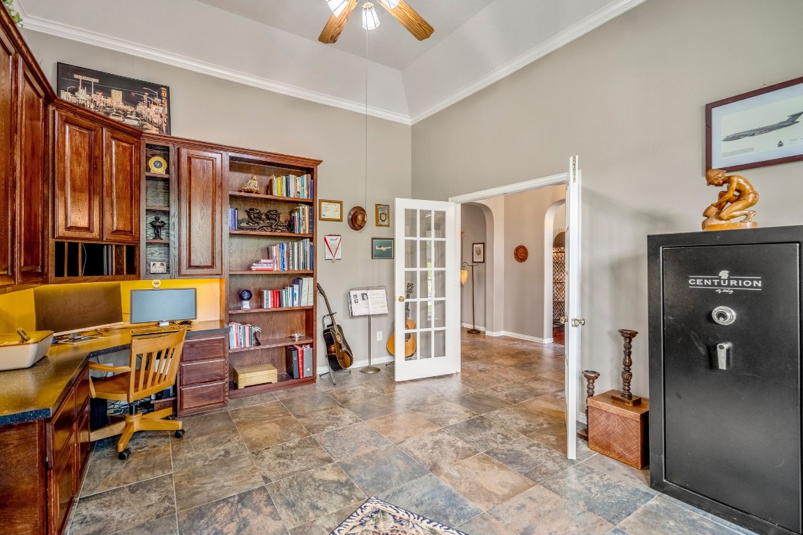 6811 PInehearth Court Spring, TX 77379 - Photo 6 of 50 Another view of the study shows the French door entry connecting back to the foyer, along with tile flooring and the vaulted ceiling that carries throughout the space.