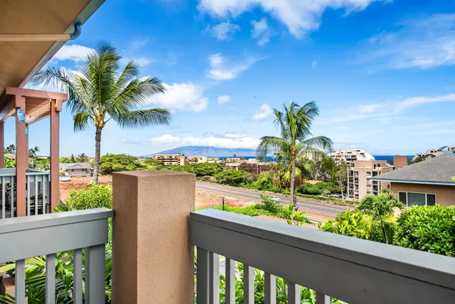 a view of a balcony with wooden floor