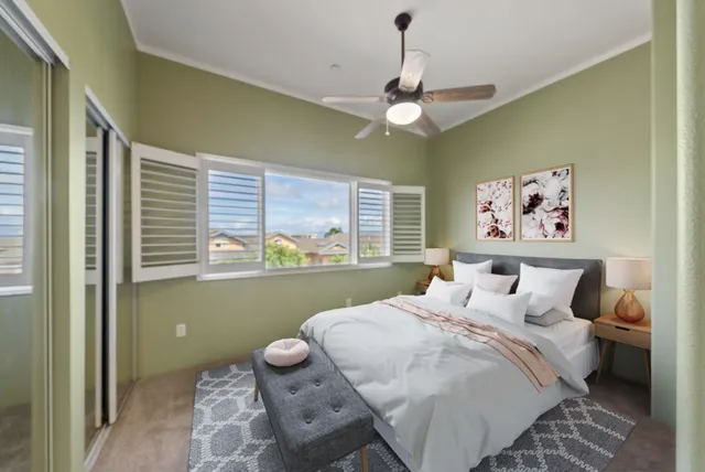 a bedroom with a bed and a window