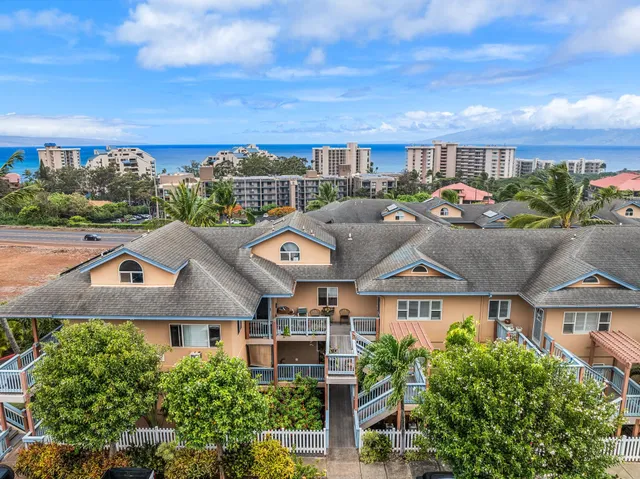 a view of a street with a garden