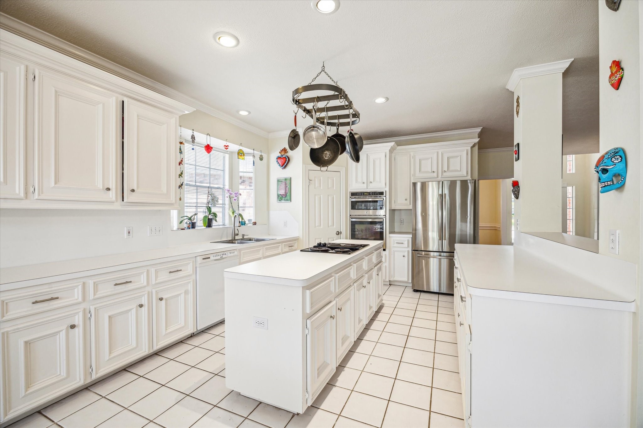 7930 Tizerton Court Spring, TX 77379 - Photo 12 of 30 a kitchen with white cabinets and appliances