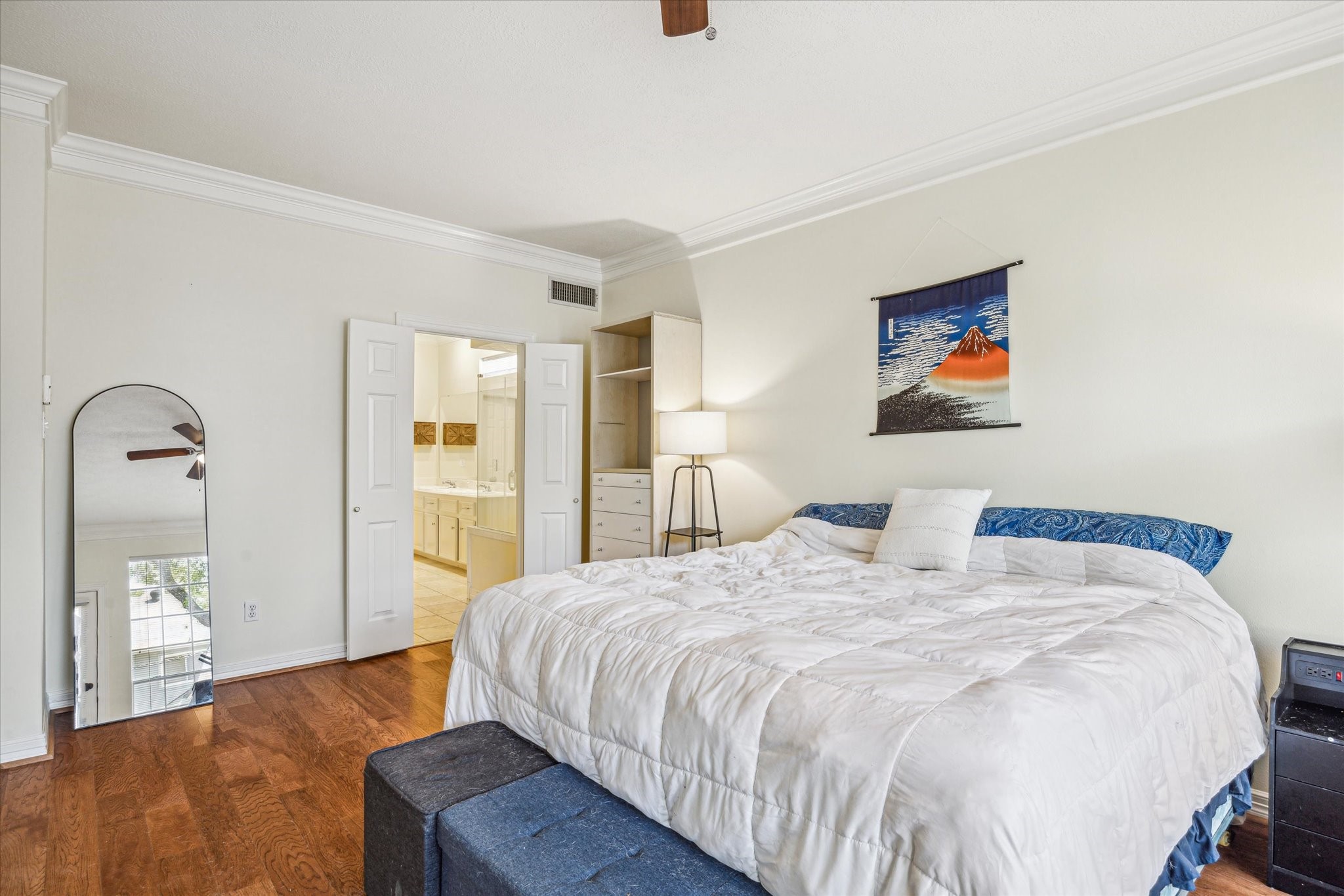 7930 Tizerton Court Spring, TX 77379 - Photo 16 of 30 a bedroom with a bed and a painting on the wall