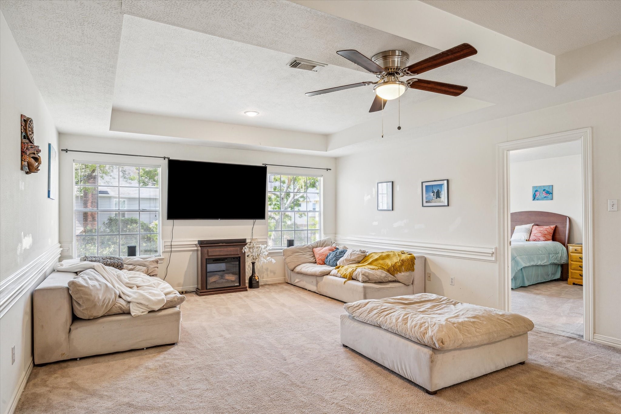 7930 Tizerton Court Spring, TX 77379 - Photo 23 of 30 a living room with furniture and a flat screen tv
