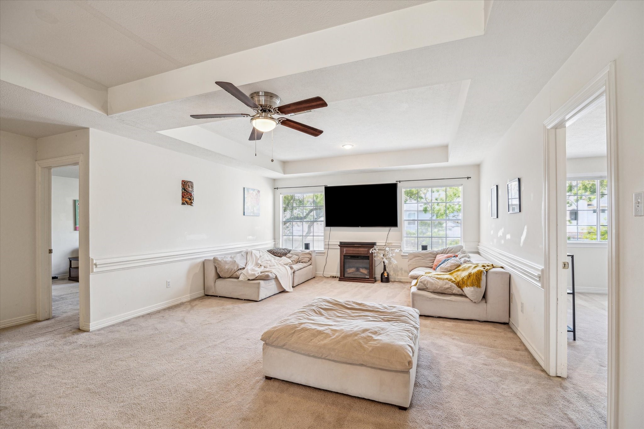 7930 Tizerton Court Spring, TX 77379 - Photo 26 of 30 a living room with furniture and a flat screen tv