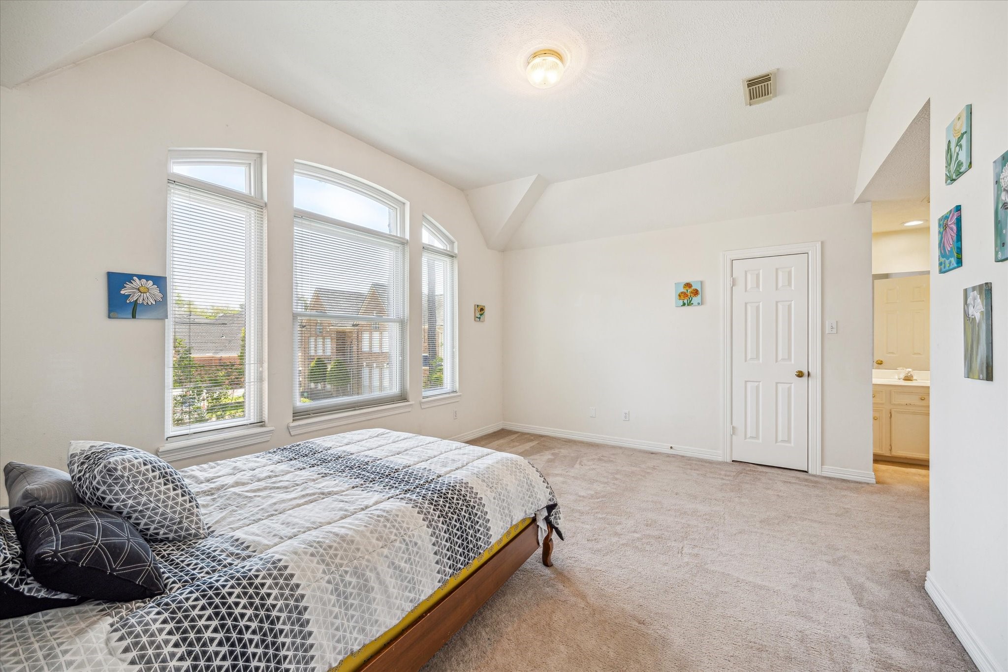 7930 Tizerton Court Spring, TX 77379 - Photo 28 of 30 a bedroom with a bed and a large window
