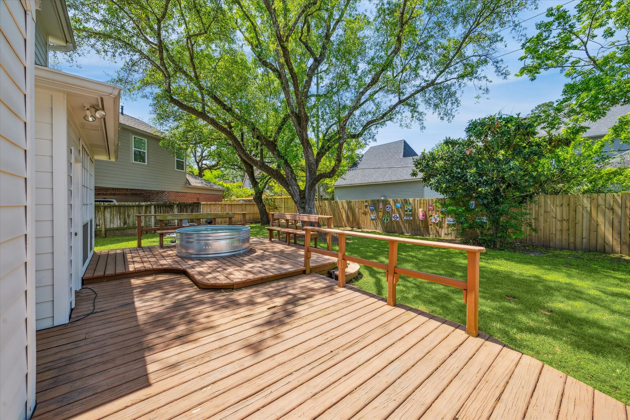 7930 Tizerton Court Spring, TX 77379 - Photo 4 of 30 a view of house with wooden deck and a backyard