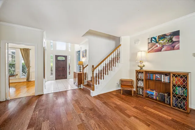a view of an entryway with wooden floor