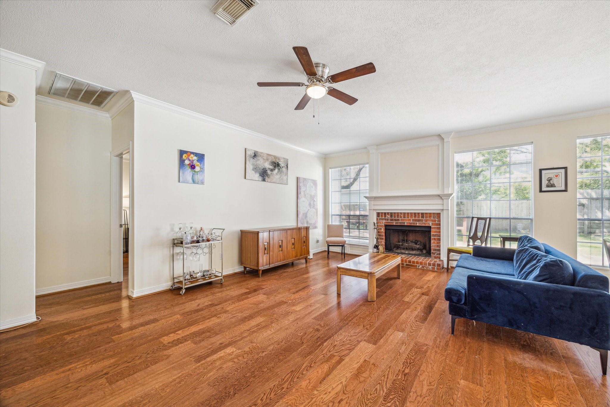 7930 Tizerton Court Spring, TX 77379 - Photo 10 of 30 a living room with furniture and a fireplace