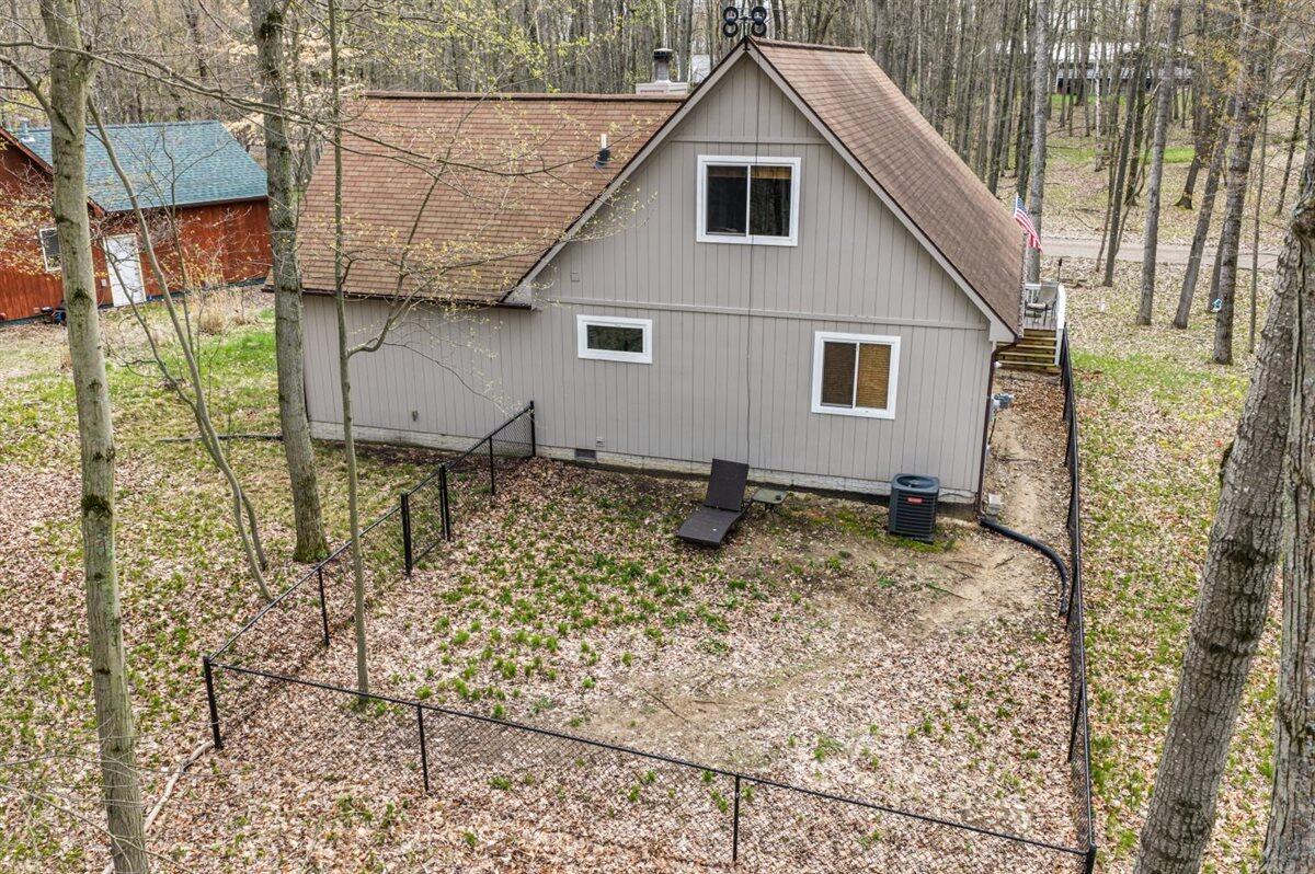 9341 Center Lane Canadian Lakes, MI 49346 - Photo 16 of 27 16 Backyard