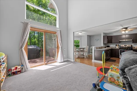 a kitchen with a stove cabinets and a wooden floor