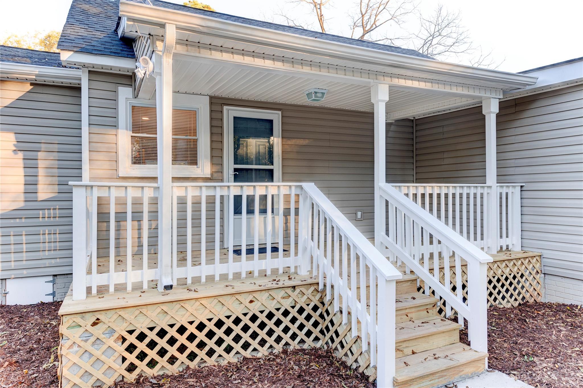 4641 Fallston Road Lawndale, NC 28090 - Photo 13 of 38 a view of a brick house with wooden fence