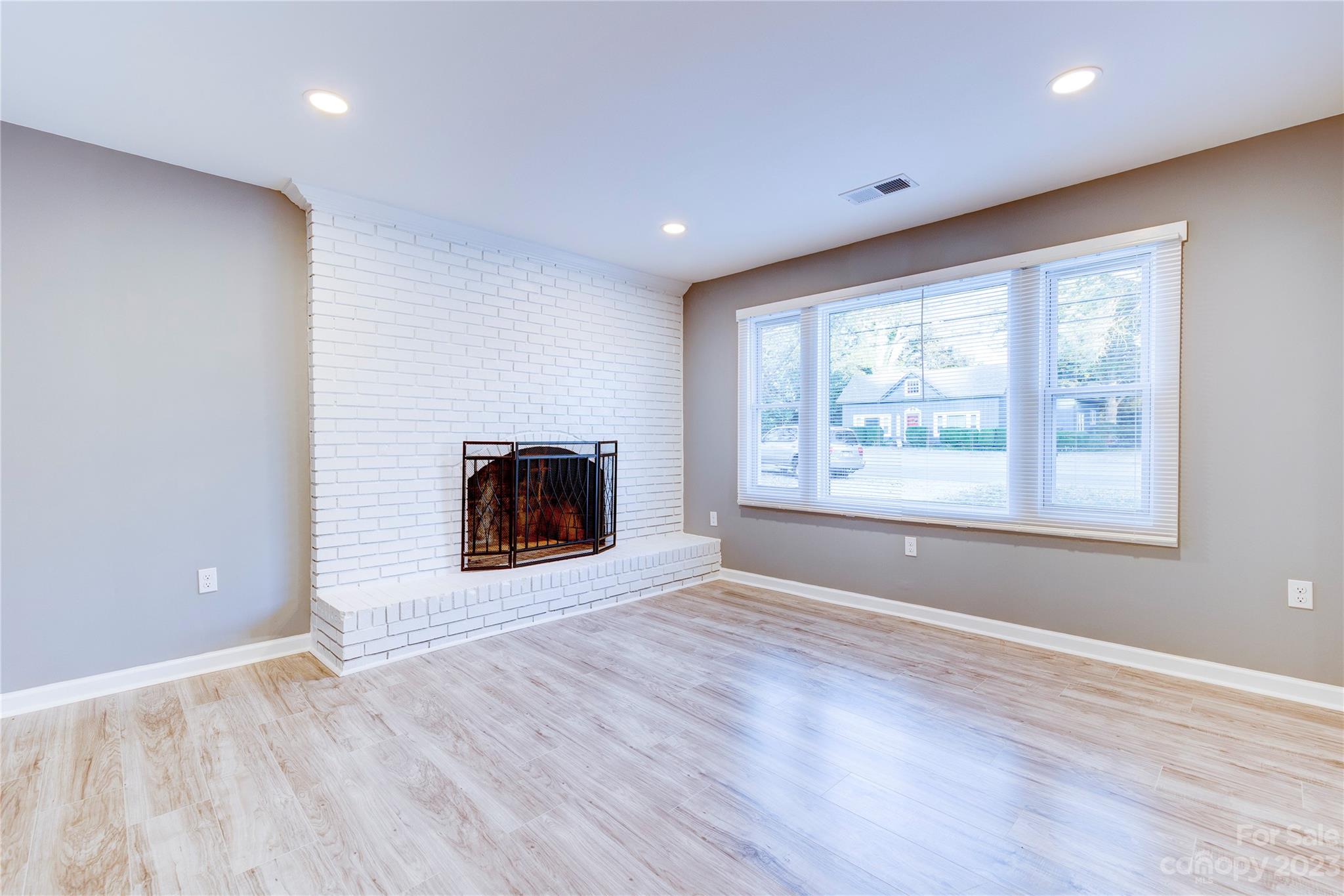 4641 Fallston Road Lawndale, NC 28090 - Photo 19 of 38 wooden floor in an empty room with a window