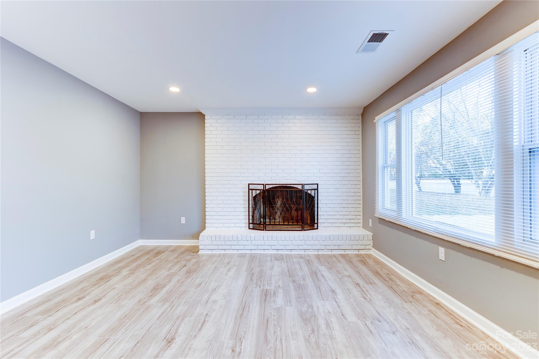 4641 Fallston Road Lawndale, NC 28090 - Photo 20 of 38 a view of an empty room with a window and wooden floor