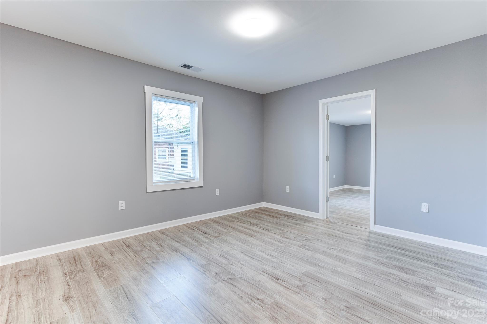 4641 Fallston Road Lawndale, NC 28090 - Photo 30 of 38 a view of an empty room with wooden floor and a window