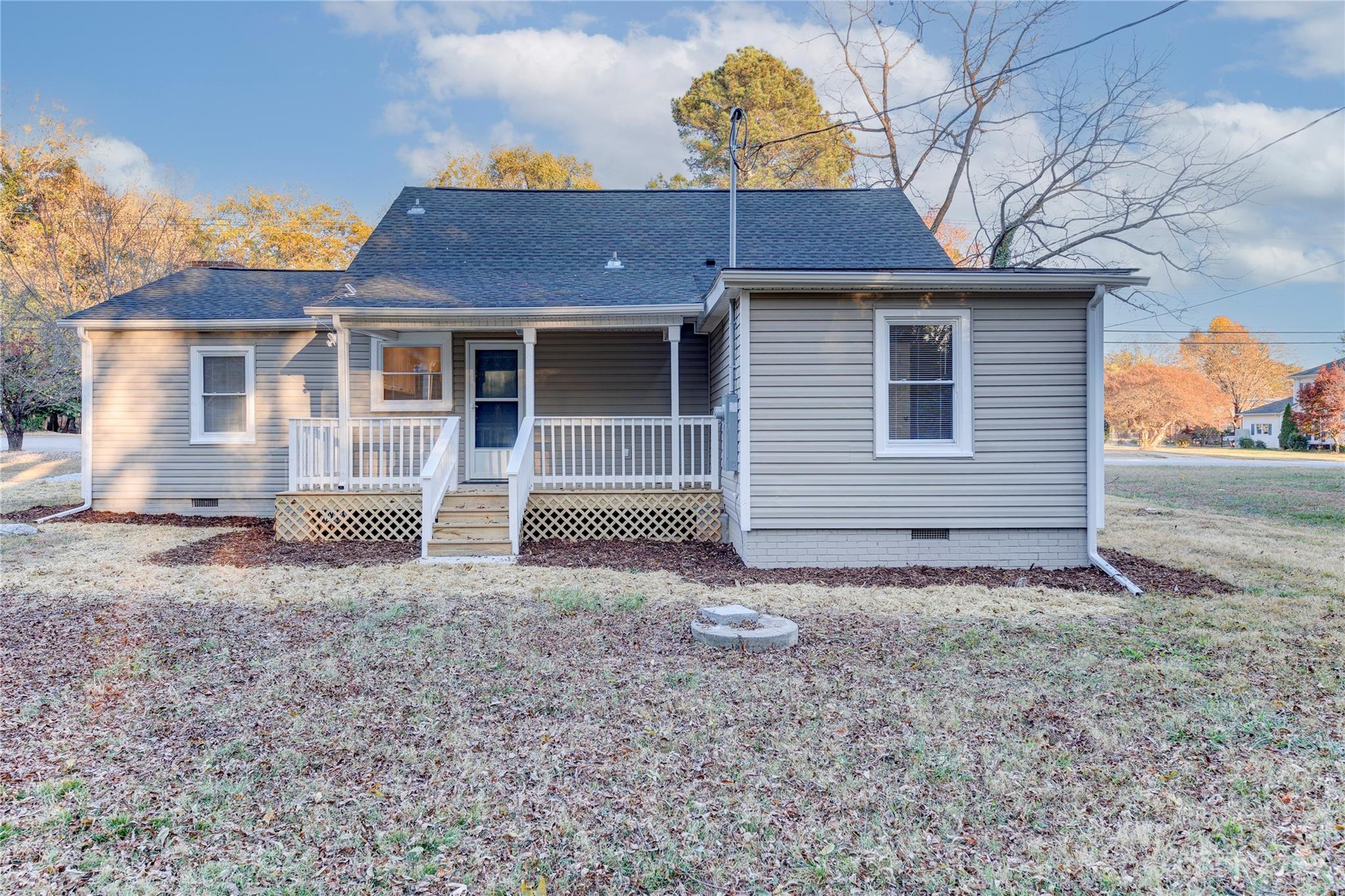 4641 Fallston Road Lawndale, NC 28090 - Photo 3 of 38 a front view of a house with garden