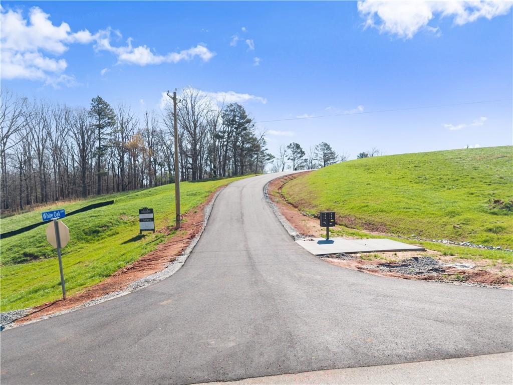 48 White Oak Trail Cleveland, GA 30528 - Photo 3 of 36 a view of a swimming pool with an outdoor space and seating area
