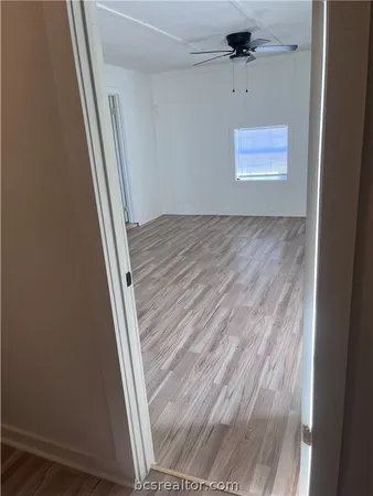 a bathroom with a granite countertop toilet a sink and mirror