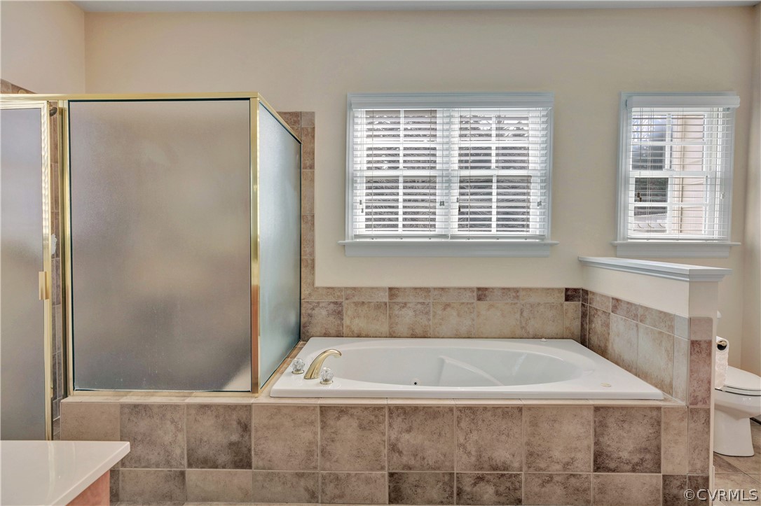 2406 Worchester Road Midlothian, VA 23113 - Photo 13 of 26 1st floor master bath features tiled jacuzzi and g