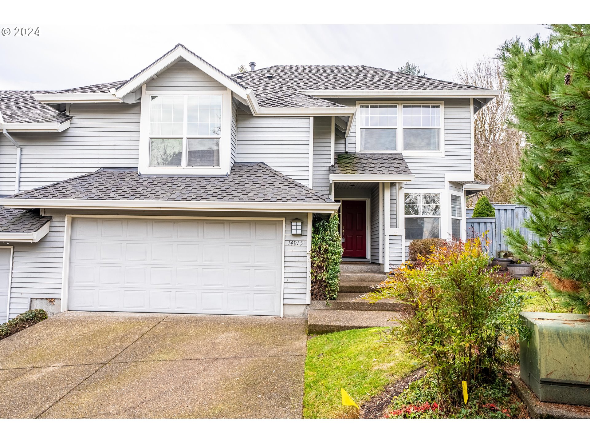 14915 Southwest Osprey Court Beaverton, OR 97007 - Photo 1 of 38 a front view of a house with a garden