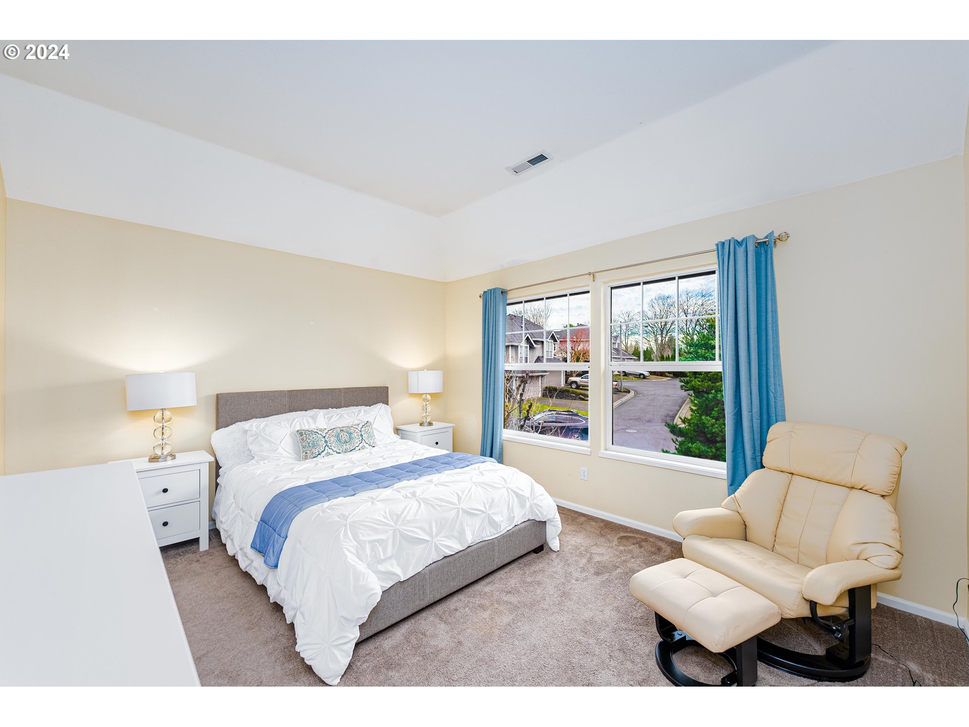 14915 Southwest Osprey Court Beaverton, OR 97007 - Photo 13 of 38 a bedroom with a bed and a large window