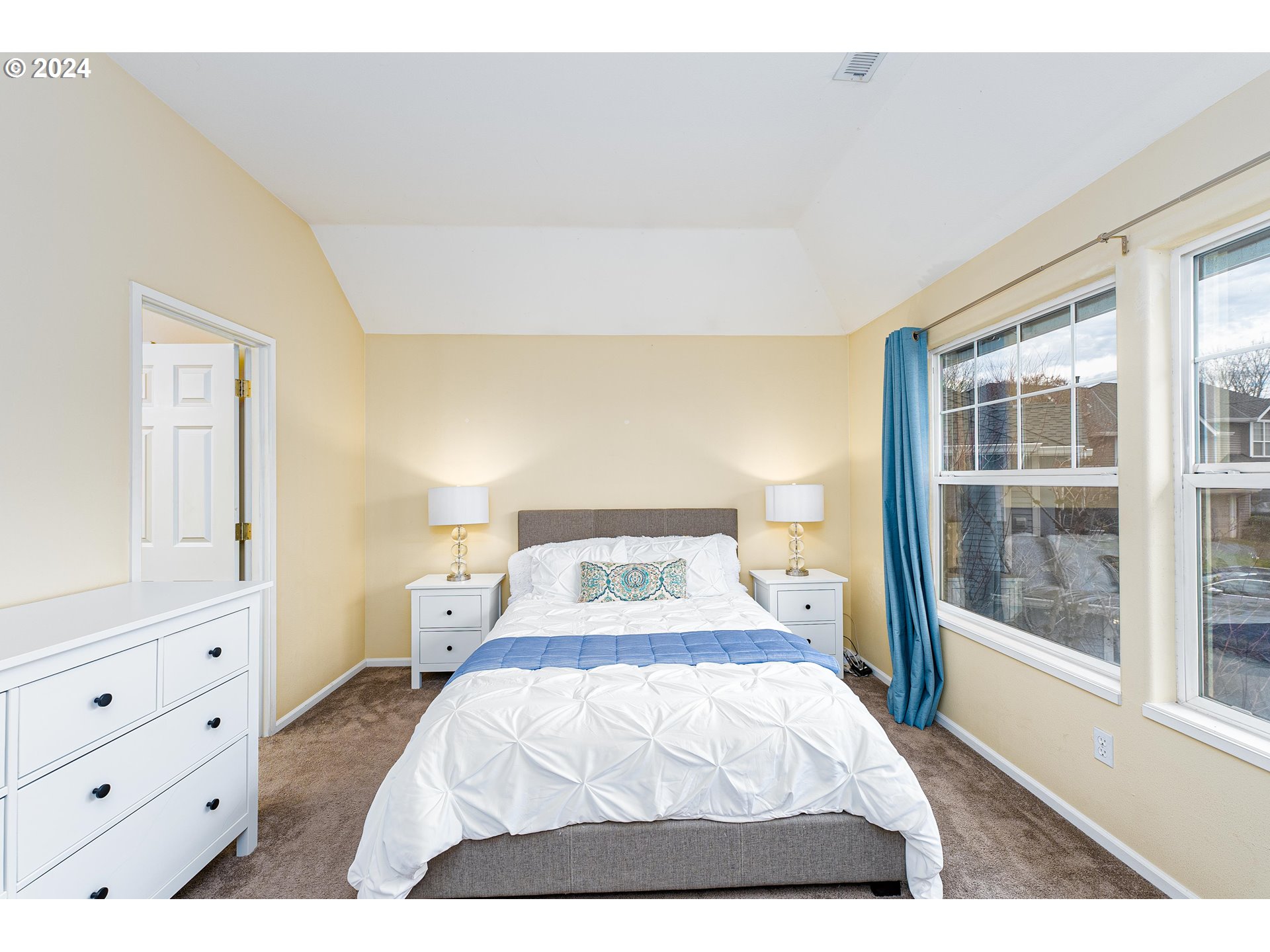 14915 Southwest Osprey Court Beaverton, OR 97007 - Photo 14 of 38 a bedroom with a bed and a window