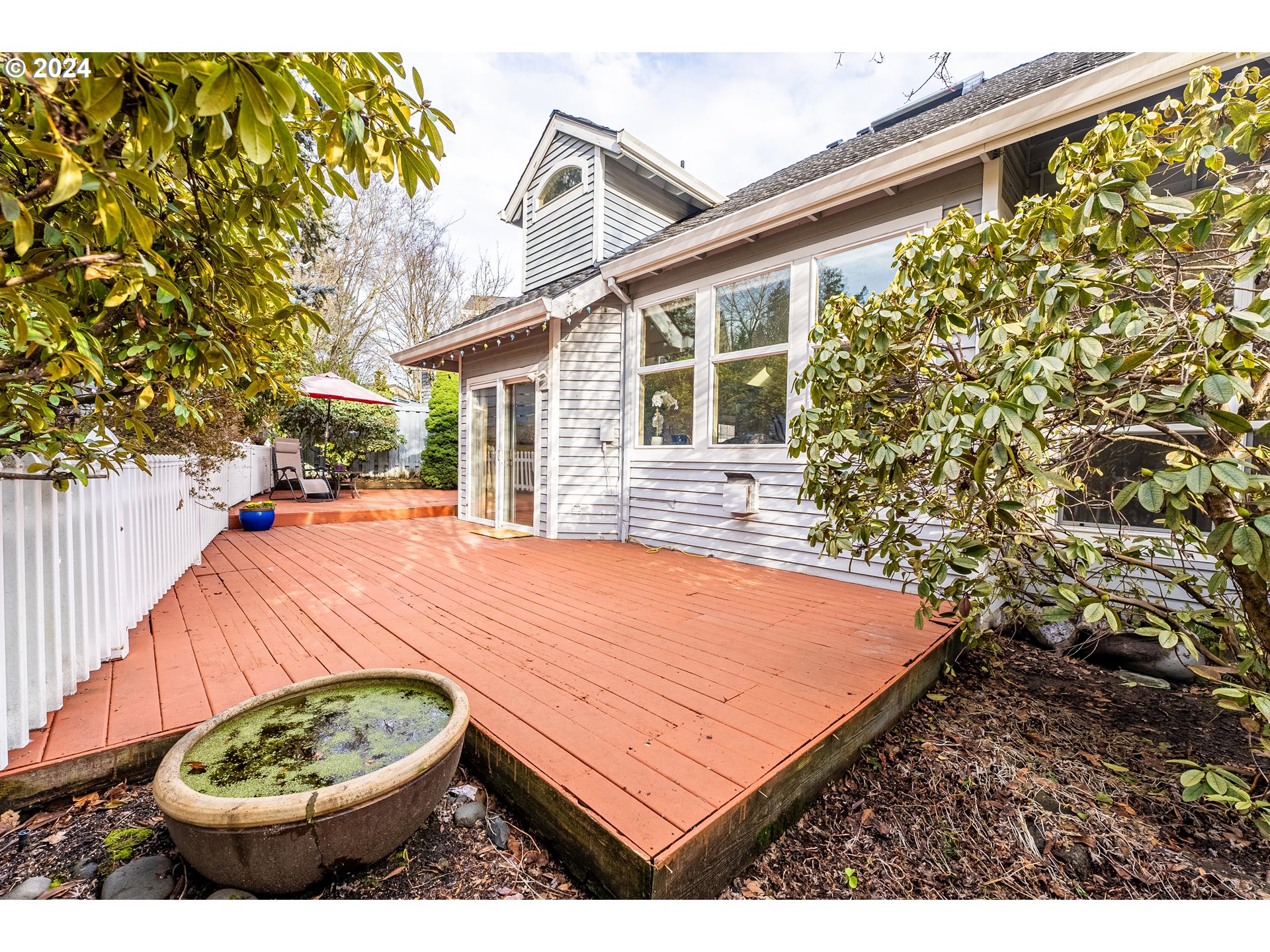 14915 Southwest Osprey Court Beaverton, OR 97007 - Photo 27 of 38 a view of a backyard with plants and a patio