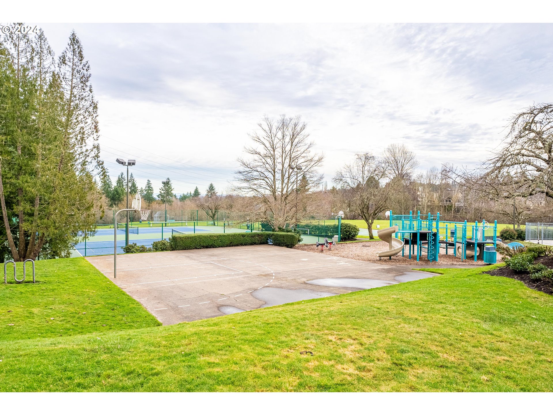 14915 Southwest Osprey Court Beaverton, OR 97007 - Photo 32 of 38 a view of a swimming pool and trees in the background