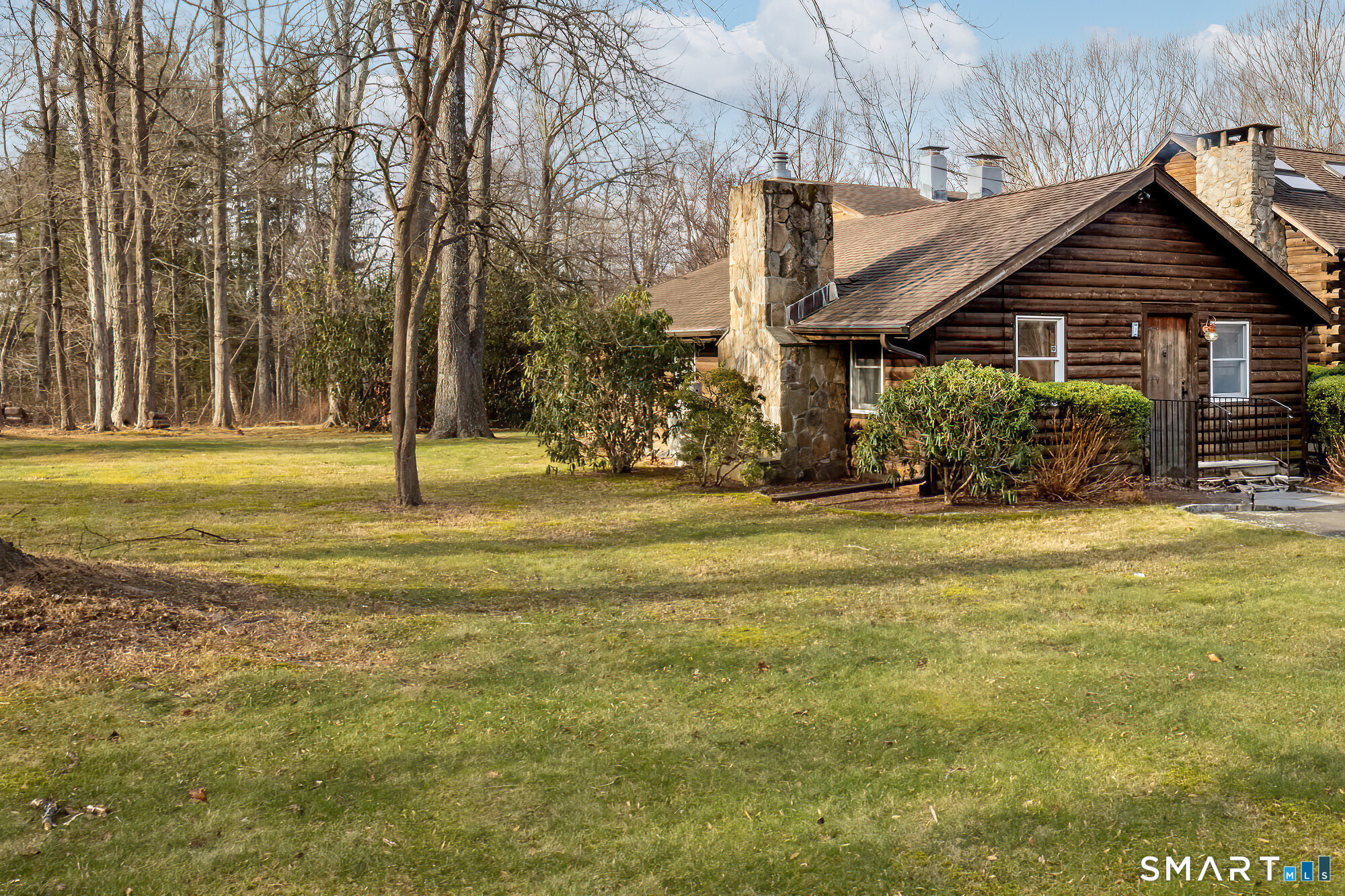 1 Long Wall Road Redding, CT 06896 - Photo 3 of 5 a front view of a house with a yard