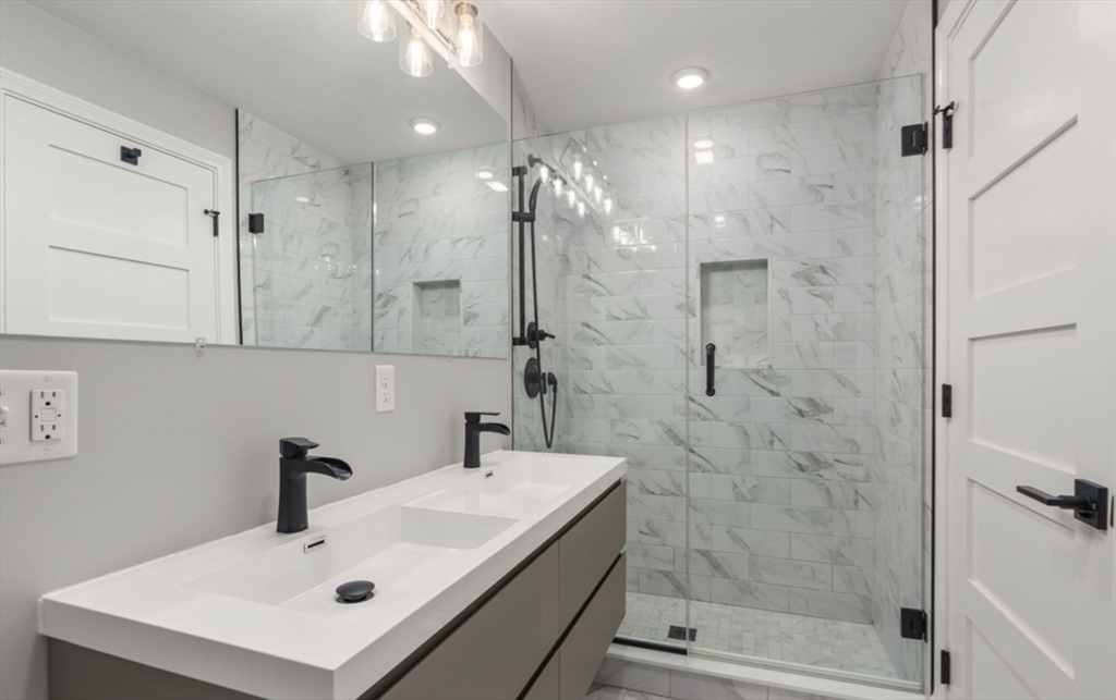101 Draper Street, Unit 2 Boston, MA 02122 - Photo 11 of 19 a bathroom with a sink shower and a mirror