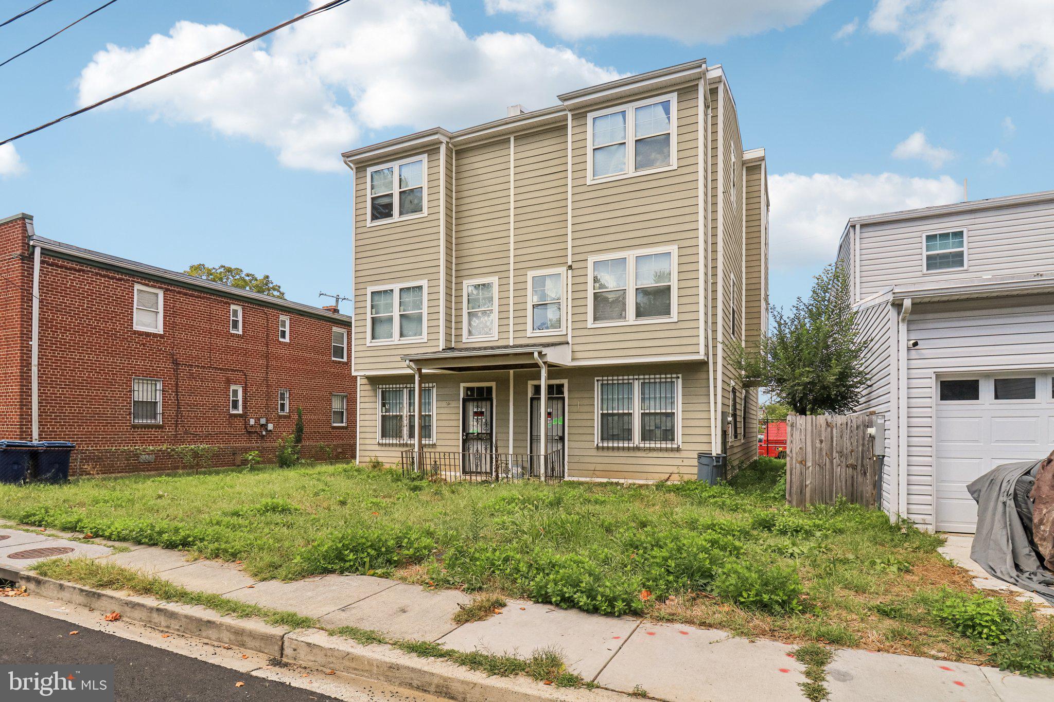 1058 44th Street Northeast Washington, DC 20019 - Photo 6 of 6 a front view of a house with garden