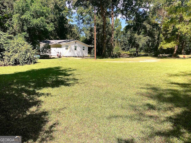 12754 State Route 96 Fort Valley, GA 31030 - Photo 22 of 26 a view of a house with a yard