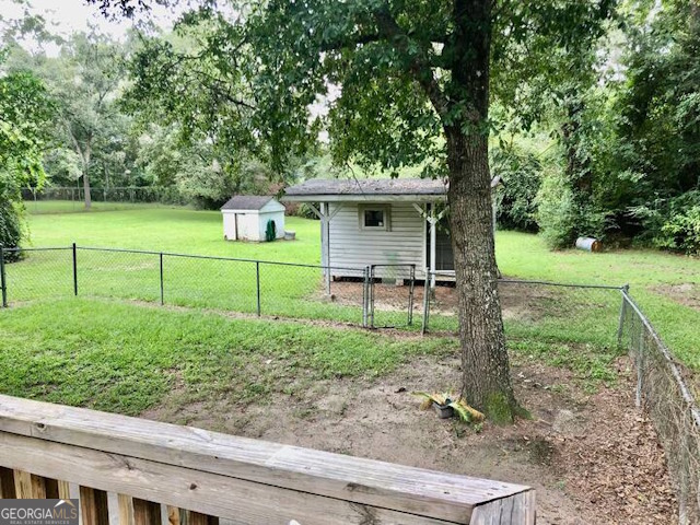 12754 State Route 96 Fort Valley, GA 31030 - Photo 23 of 26 a view of a backyard with wooden fence and a bench