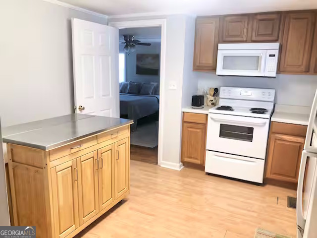 12754 State Route 96 Fort Valley, GA 31030 - Photo 8 of 26 a kitchen with stainless steel appliances granite countertop a stove and a sink