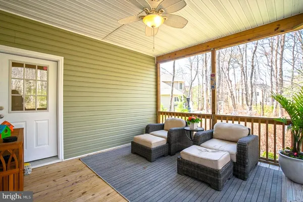 a bedroom with furniture and wooden floor