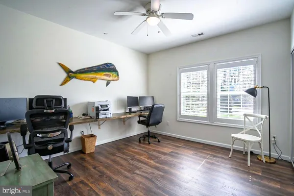a workspace with furniture hardwood and a window
