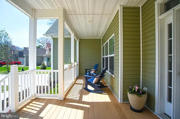 a view of a balcony with chairs