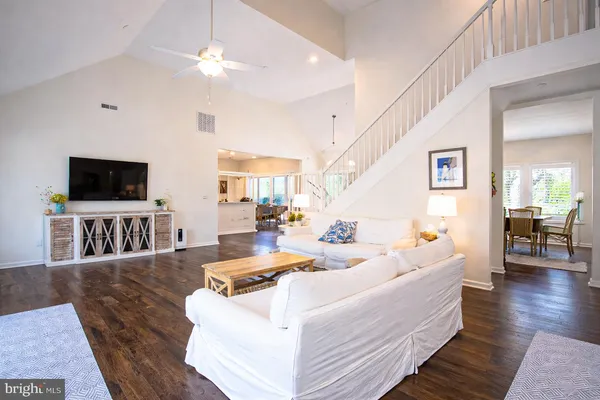 a living room with fireplace furniture and a flat screen tv
