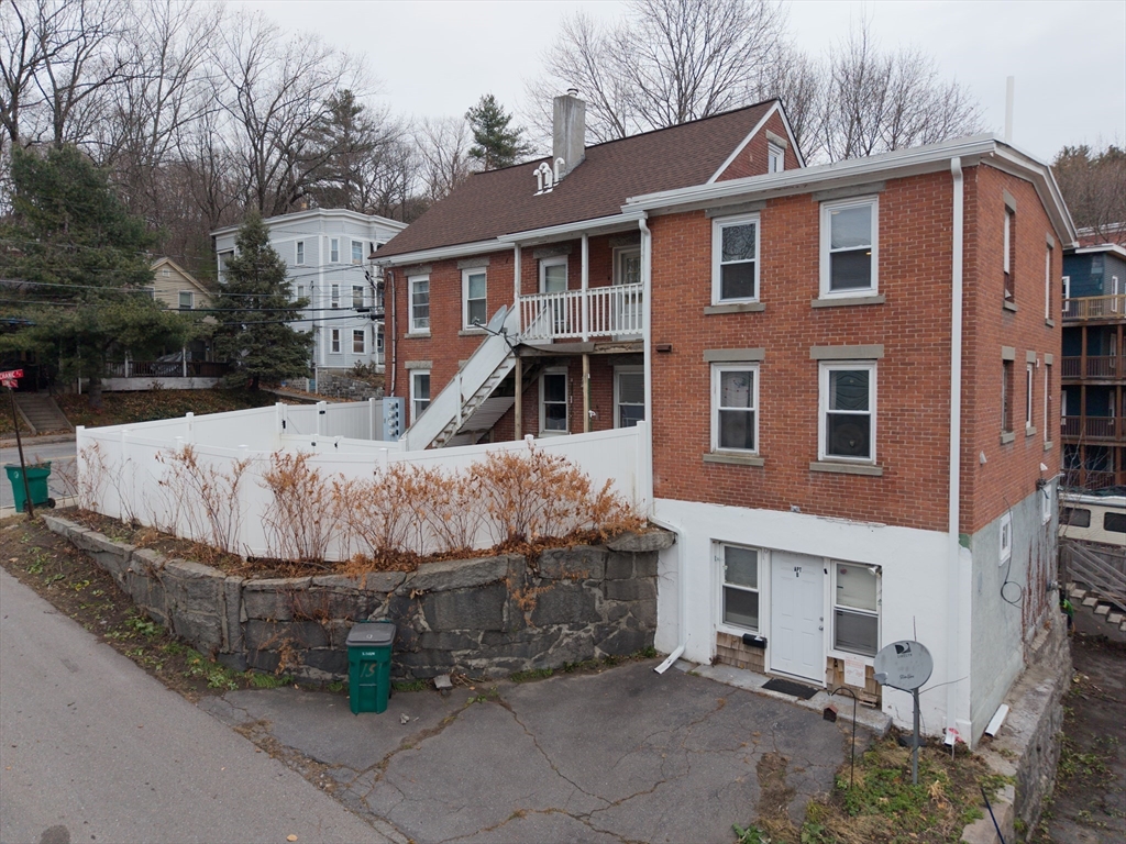 151 Mechanic Street Fitchburg, MA 01420 - Photo 1 of 42 a front view of a house with a garage