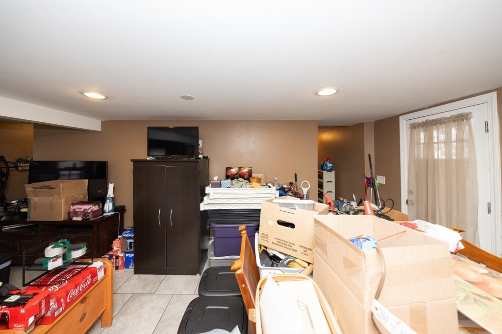 151 Mechanic Street Fitchburg, MA 01420 - Photo 17 of 42 a bed room with a bed and a television