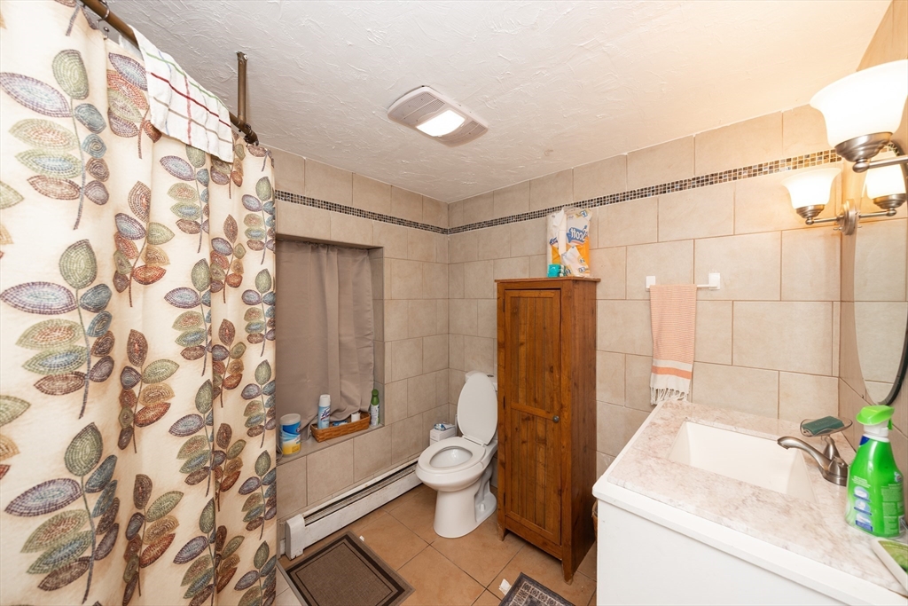 151 Mechanic Street Fitchburg, MA 01420 - Photo 22 of 42 a bathroom with a sink toilet and shower
