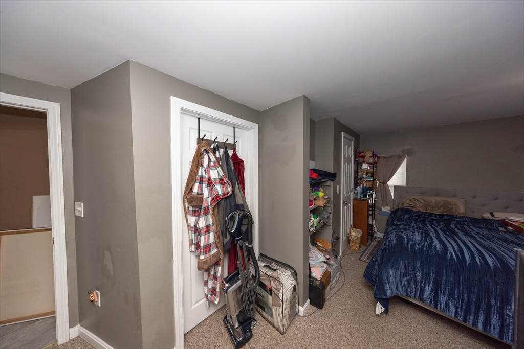 151 Mechanic Street Fitchburg, MA 01420 - Photo 24 of 42 a view of walk in closet with clothes