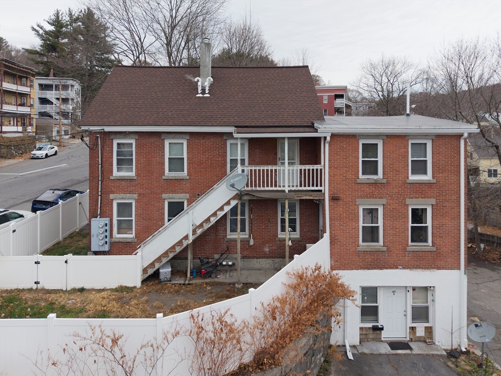 151 Mechanic Street Fitchburg, MA 01420 - Photo 3 of 42 a view of a house with a yard