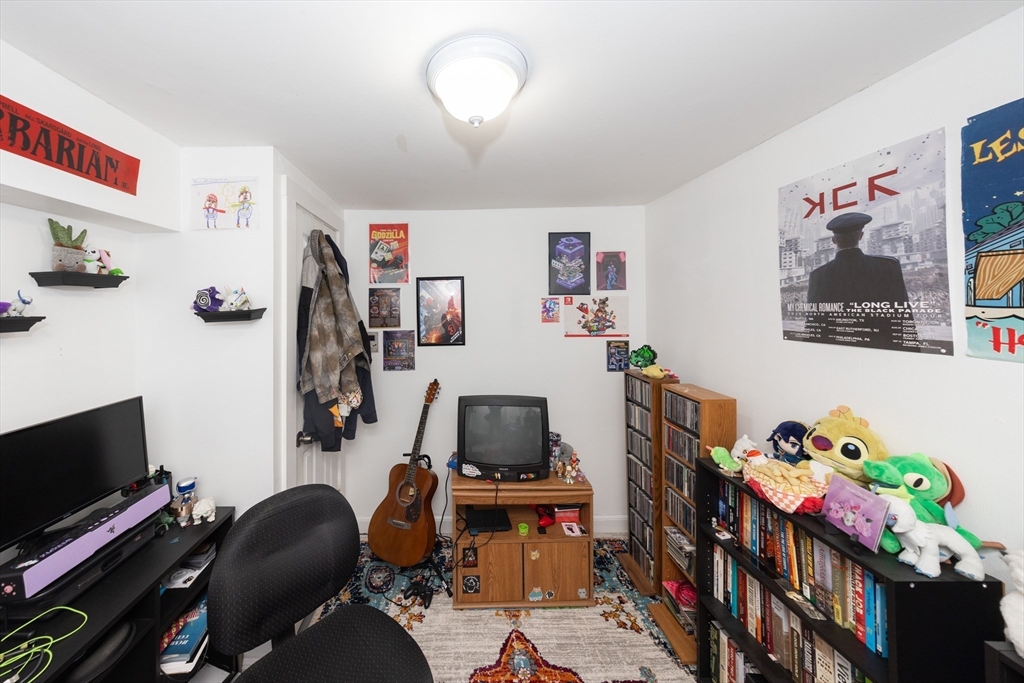 151 Mechanic Street Fitchburg, MA 01420 - Photo 31 of 42 a room with furniture and wooden floor
