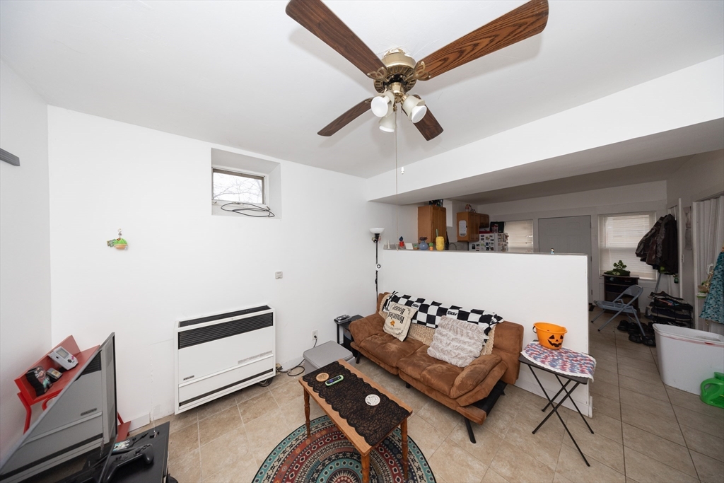 151 Mechanic Street Fitchburg, MA 01420 - Photo 35 of 42 a living room with furniture and white walls