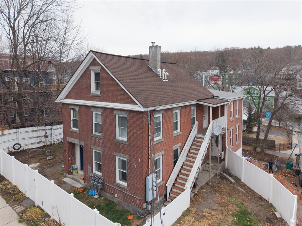 151 Mechanic Street Fitchburg, MA 01420 - Photo 4 of 42 a front view of a house with a yard