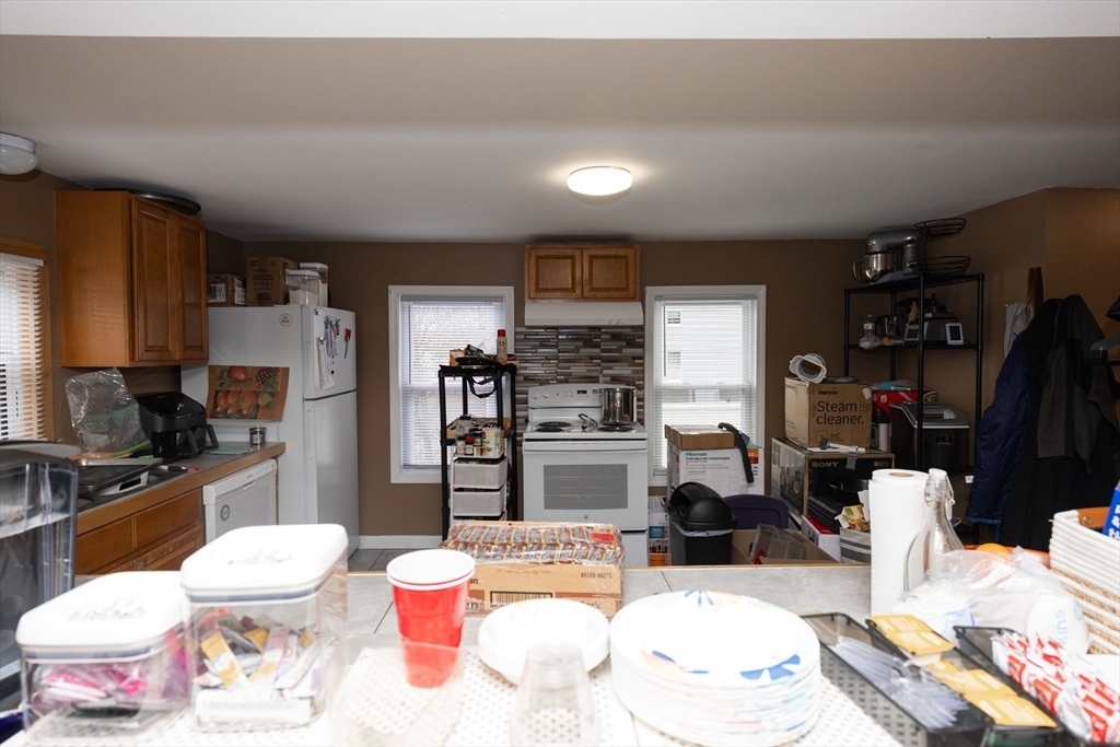 151 Mechanic Street Fitchburg, MA 01420 - Photo 9 of 42 a room with furniture a flat screen tv and a table