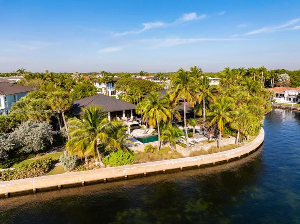 an aerial view of a house with a ocean view