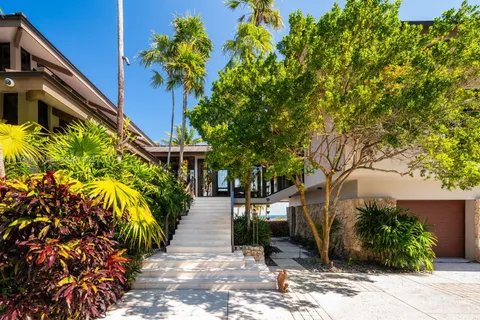 a kitchen with stainless steel appliances granite countertop a sink and a stove