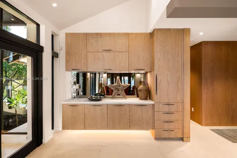 a large bedroom with a large bed and a large window