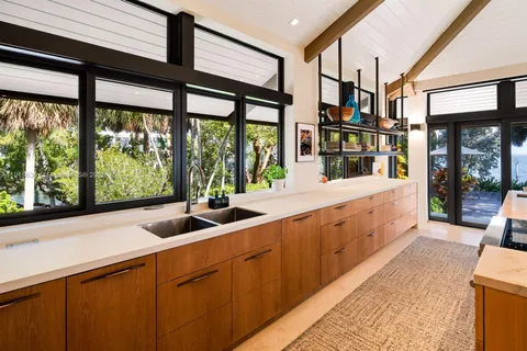 a bedroom with a bed and a flat tv